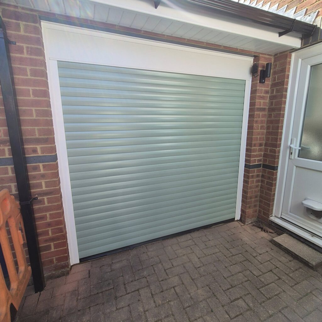 trojon roller door in chartwell green installed in berkhamsted